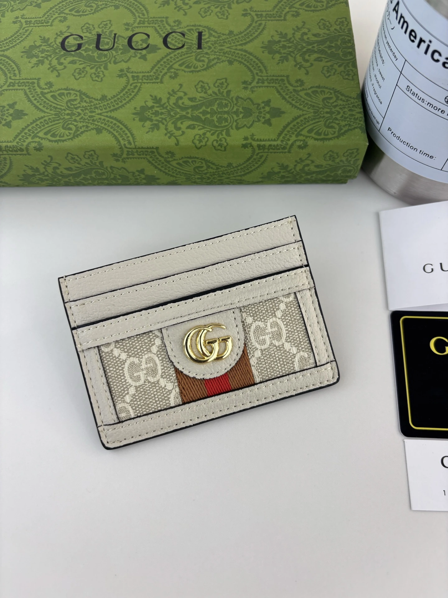 Gucci(グッチ / Gucci)公式サイト同期新作 Ophidiaシリーズ~ミニカードケース、GG SupremeハイグレードPVC素材にアイコンのダブルG金具ロゴ付き、クラシックな茶赤ウェビングテープで精巧に製作